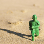 regulatory_sandbox_green_soldier_in_sand.png